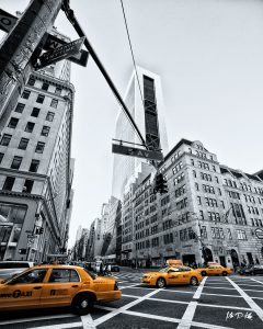 image of yellow taxis on 5th avenue in new york city