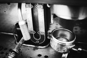 Black and white image of a decommissioned Vittorio Espresso machine head by Mr P Kalu